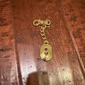 Marino Orlando gold tone oval 5.75”  key chain charm fob. Made in Italy.
